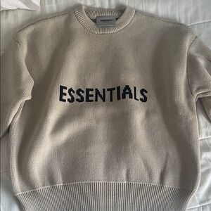 Essentials Women’s Cream Crewneck Sweater with Black Logo